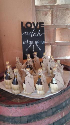 a display of bottles of wine on a table at Villa Palazzo Bello con piscina e AC - Cetona in Cetona