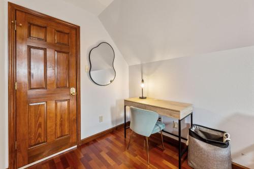 a room with a table and a mirror and a door at Golf-Side Luxe Escape Sleeps 13 Hot Tub & Theater in Port Arthur