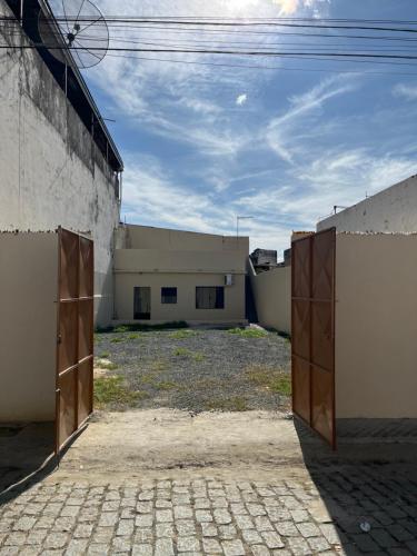 an open pair of doors in a building at Casa Mãe Ternura in Aparecida