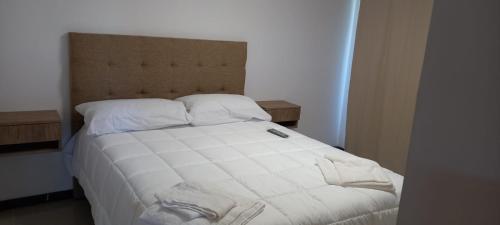 En eller flere senge i et værelse på Veneto Village