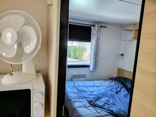 Postel nebo postele na pokoji v ubytování Mobilhome La Réserve - 3 ch - 6 pers - Terrasse