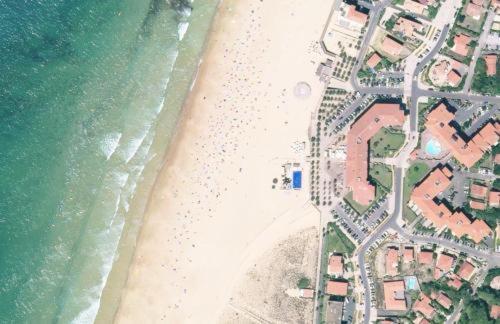 an aerial view of a beach with houses and the ocean at Appartement HOSSEGOR plage SUD Classé 3 étoiles in Soorts-Hossegor