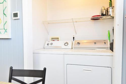 a laundry room with a washer and dryer at Suns Out Steps to Beach w Private Pool in Cherry Grove in Myrtle Beach