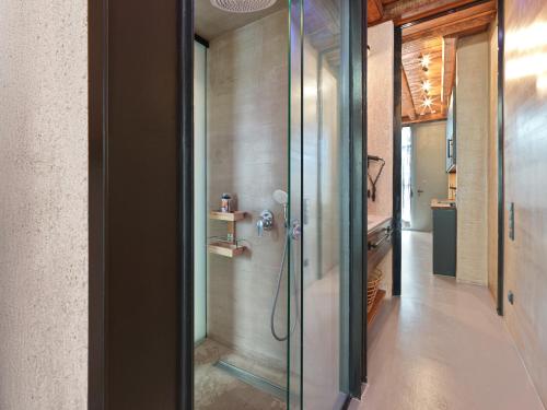 a bathroom with a shower with a glass door at Sea View Garden Suites in Piraeus