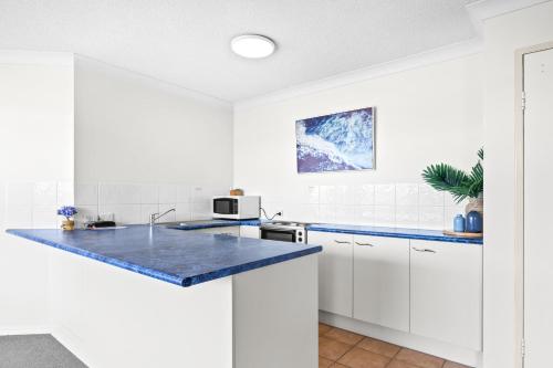 Belaire Place Motel Apartmentsにあるキッチンまたは簡易キッチン