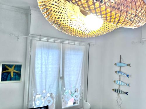 a chandelier hanging from a ceiling in a room at The Beach house in Platanitis Rodopis