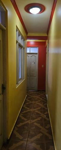 an empty hallway with a door and a ceiling at Apartamento Rosita in La Playa Bejarano