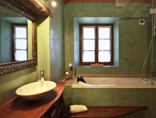 a bathroom with a sink and a tub and a sink at Monte D´Sancho in Aljezur