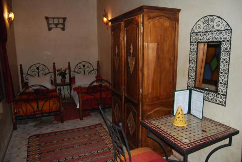 a room with a dresser and a table with a mirror at Caverne d'Ali Baba in Essaouira