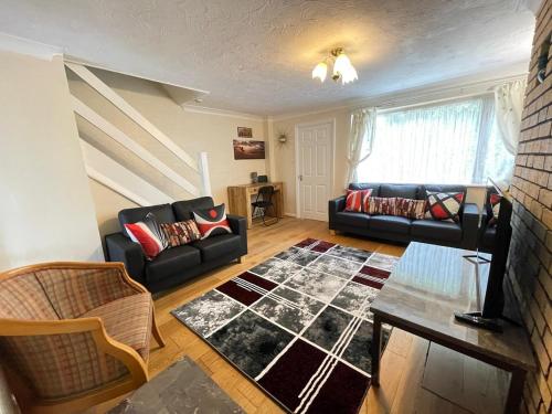 Χώρος καθιστικού στο Cosy 3 Bedroom House in Luton