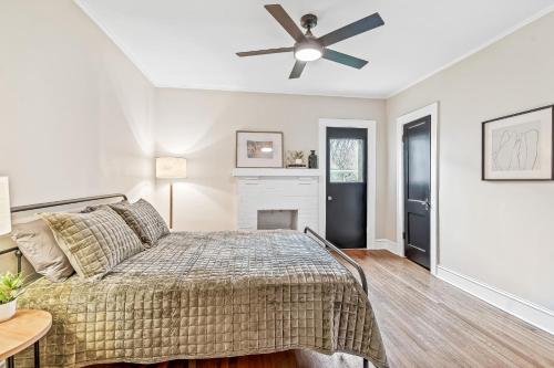 a bedroom with a bed and a ceiling fan at Luxurious Retreat in Historic Downtown Burlington Downstairs Only in Burlington