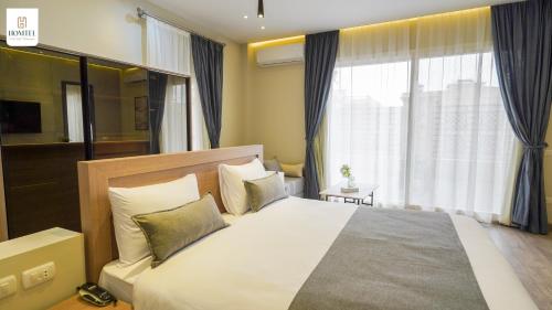 Ένα ή περισσότερα κρεβάτια σε δωμάτιο στο Homtel Residence West Golf - Fifth Settlement