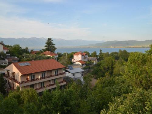 a town with a lake in the background at Vila Stefani in Star Dojran