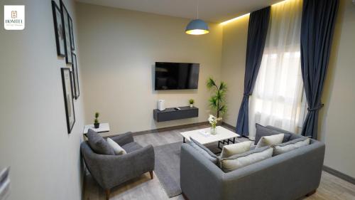 Μια τηλεόραση ή/και κέντρο ψυχαγωγίας στο Homtel Residence West Golf - Fifth Settlement