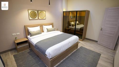 Ένα ή περισσότερα κρεβάτια σε δωμάτιο στο Homtel Residence West Golf - Fifth Settlement
