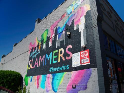 a building with colorful graffiti on the side of it at The Standard Downtown Columbus in Columbus