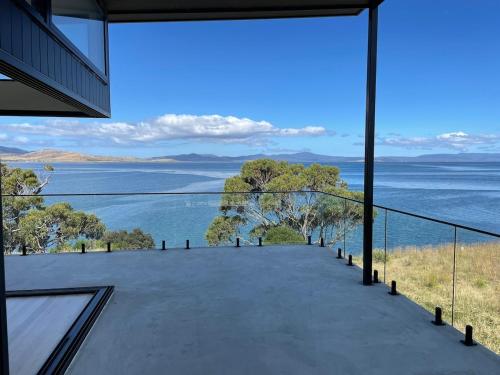 a view of the water from the balcony of a house at Waterfront 'Tupelo' with Sauna on Primrose Point in Primrose Sands