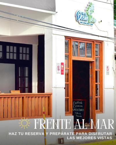 a front door of a building with a sign on it at Hotel Ocean View in San Juan del Sur