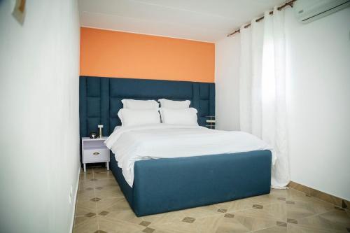 Llit o llits en una habitació de Résidences Ébènes