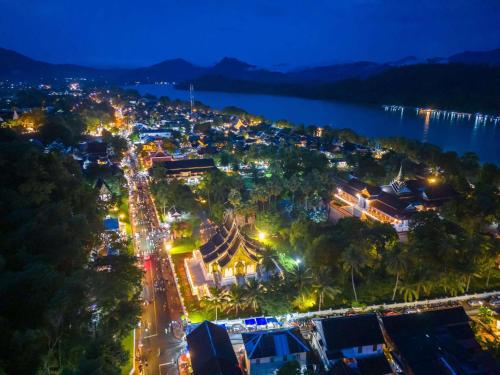 a view of a city at night at Luang Prabang Golden Lotus Villa River View in Luang Prabang
