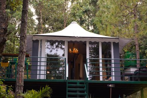 a gazebo in the middle of a forest at 2 Luxury Tents in Majkhali- Chinar & Apricot in Chaubattia