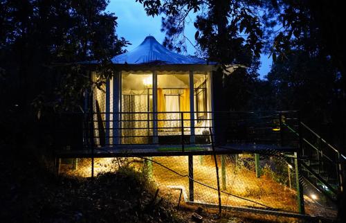 a gazebo in a forest at night at 2 Luxury Tents in Majkhali- Chinar & Apricot in Chaubattia