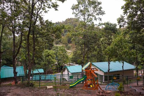 a park with a playground with a slide at 2 Luxury Tents in Majkhali- Chinar & Apricot in Chaubattia