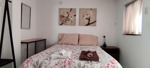 Ένα ή περισσότερα κρεβάτια σε δωμάτιο στο Cozy Apartment in Sucre