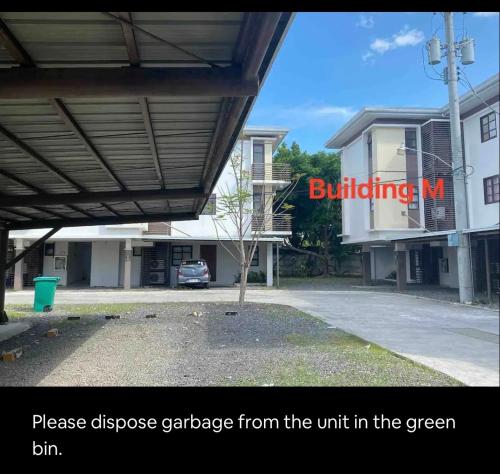 a building with the wordsbuildingapse garage from the unit in the green bin at Cozy 1-Br Home-Away-from-Home in Lapu Lapu City