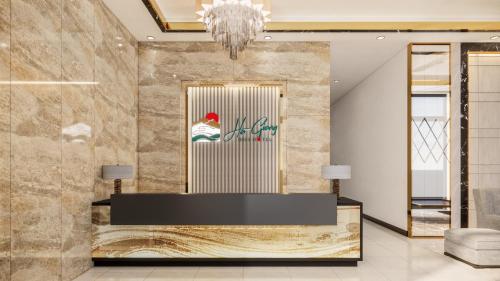 a lobby with a reception desk and a chandelier at Ha Giang Hill Hotel in Dồng Văn