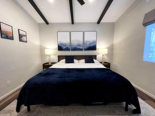a bedroom with a large bed and two lamps at Redwood Oasis, Grove and Nook in Felton