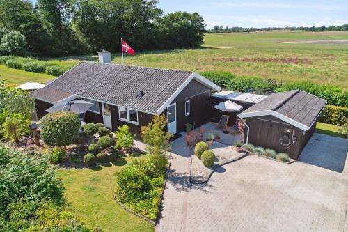 an overhead view of a house with a flag on it at Beautiful Summer House For 8 People And 2 Dogs in Karrebæksminde
