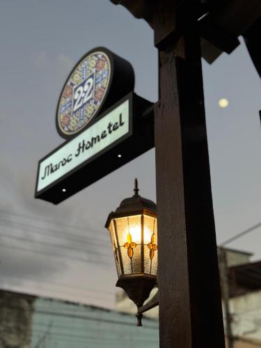a street sign and a light on a pole at 22 Maroc Hometel in Hat Yai