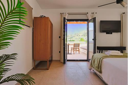 Ένα ή περισσότερα κρεβάτια σε δωμάτιο στο La Maltese Boutique Paros