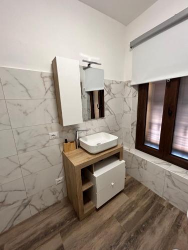 a bathroom with a sink and a mirror at Caprotti 6 in Magenta