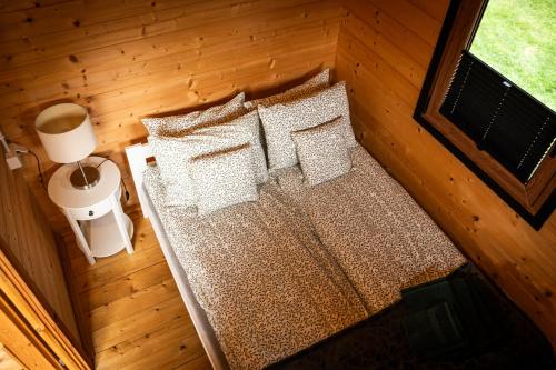 an overhead view of a bed in a cabin at Relax domki Zator in Zator