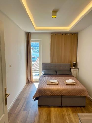 Ένα ή περισσότερα κρεβάτια σε δωμάτιο στο Villa Lungomare