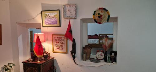 a room with two mirrors and a lamp on a wall at hostel Banana in Tangier