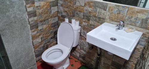 a bathroom with a toilet and a sink at hostel Banana in Tangier