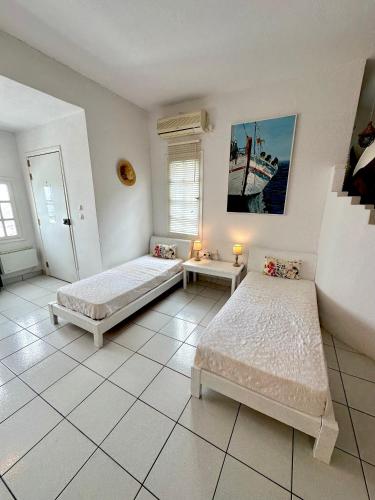 Letto o letti in una camera di Villa Zografos