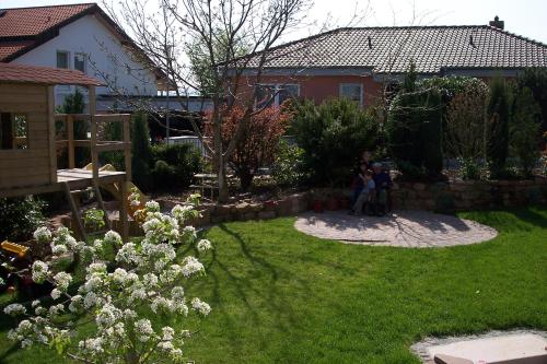 a group of people standing in a yard at Ferienwohnung Kugel in Landau in der Pfalz