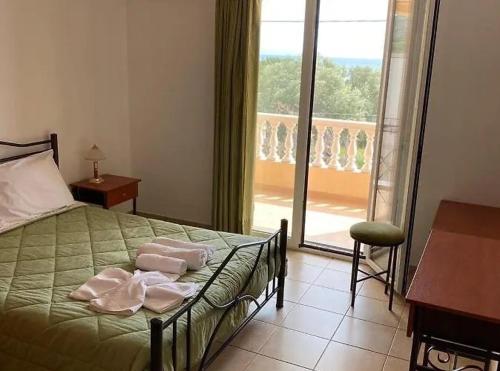 Ένα ή περισσότερα κρεβάτια σε δωμάτιο στο Marialena hotel