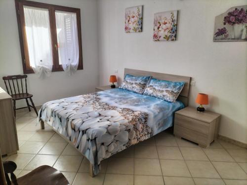 Ένα ή περισσότερα κρεβάτια σε δωμάτιο στο Residenza Sa Conzola