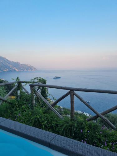 a view of the ocean from the balcony of a house at Villa Alba - Zaffiro in Amalfi