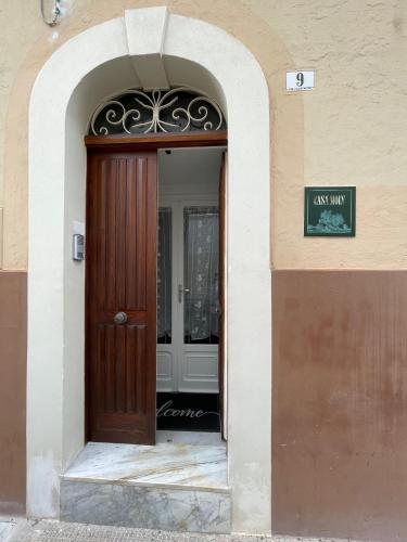 an entrance to a building with a wooden door at Casa Moly in Monopoli