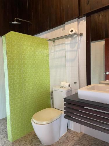 a bathroom with a toilet and a sink at Luang Prabang Inn 1 in Luang Prabang