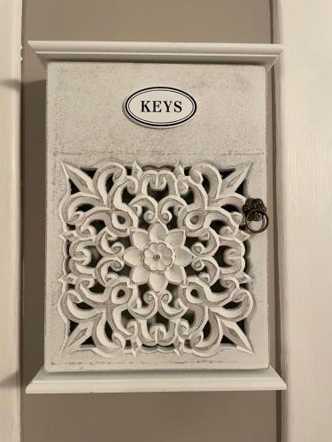 a door with a carving of a flower on it at Casa Moly in Monopoli