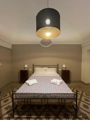 a bedroom with a bed with two pillows on it at Casa Moly in Monopoli
