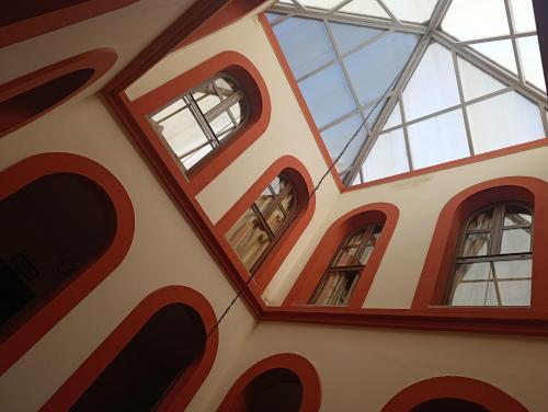 a group of windows on the side of a building at Jayca in Trujillo