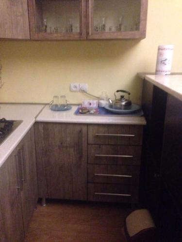 a kitchen with a sink and a counter top at Leila Apartment in Tbilisi City